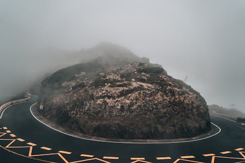 Black and Brown Mountain Under White Sky