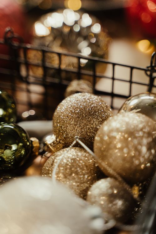 Free Festive glittering baubles creating a cozy Christmas atmosphere indoors. Stock Photo