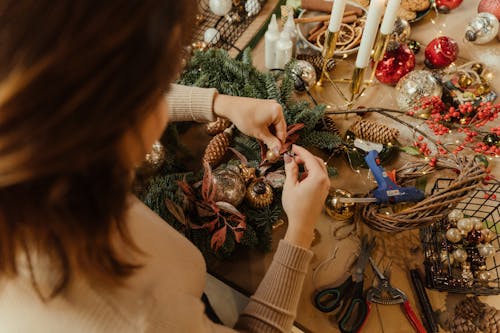 A Person Making Christmas Decorations