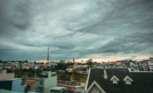 White and Brown Concrete Houses Under Gray Sky