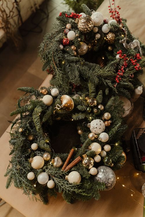 Free Two beautifully decorated Christmas wreaths with baubles and ornaments, perfect for festive indoor decoration. Stock Photo