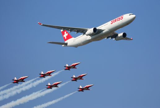 Airplane and Jets Flying in the Blue Sky