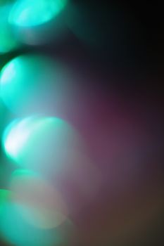 A vibrant abstract image featuring dynamic gradient colors and soft illuminations.