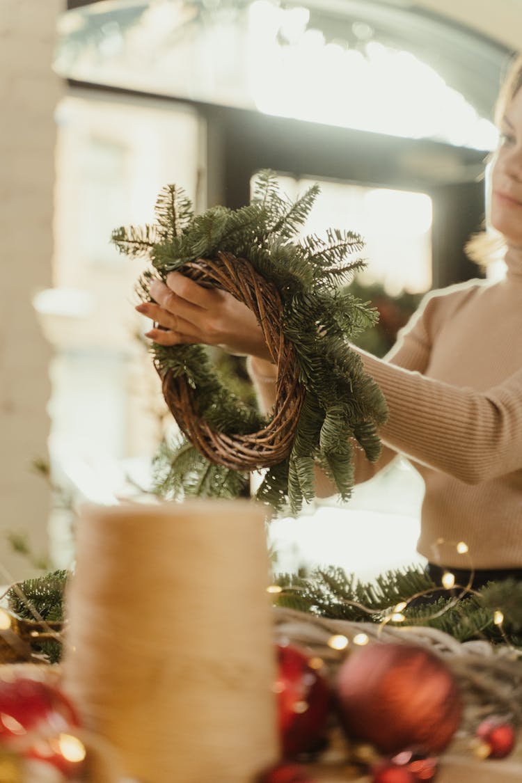 A Woman Making Hanging Wreath