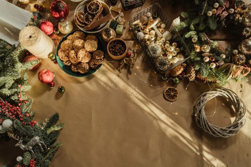 Free Top view of a holiday table with decorations and cookies, perfect for Christmas DIY ideas. Stock Photo