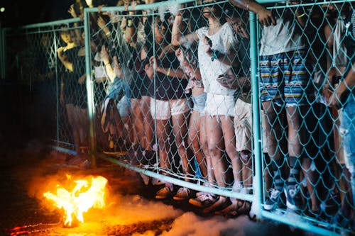 Free People Outside the Fence Stock Photo