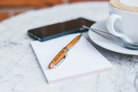 Wooden Click Pen on White Paper