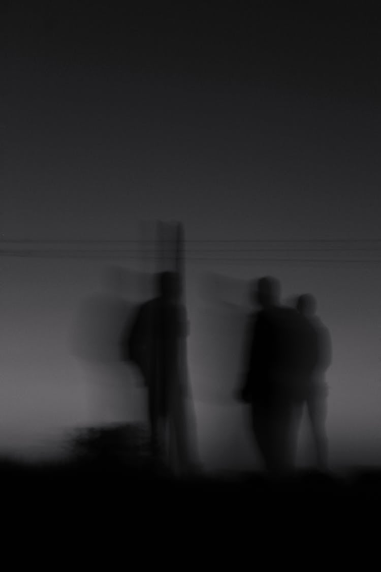 Silhouette Of A Group Of People Standing