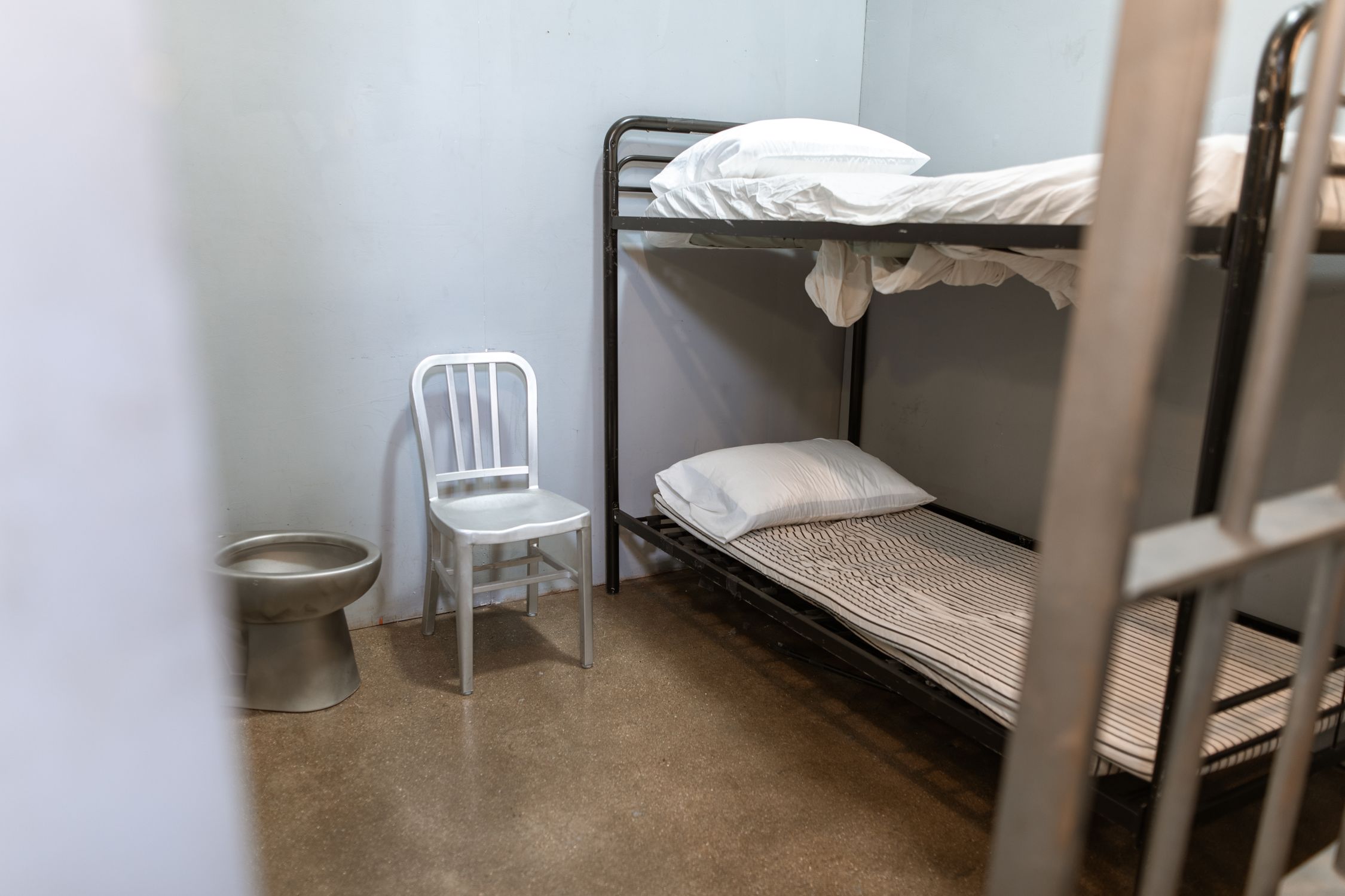 Modular Inmate Bunks A Bunk Bed With Striped Foam Mattress in a Prison Cell · Free Stock Photo