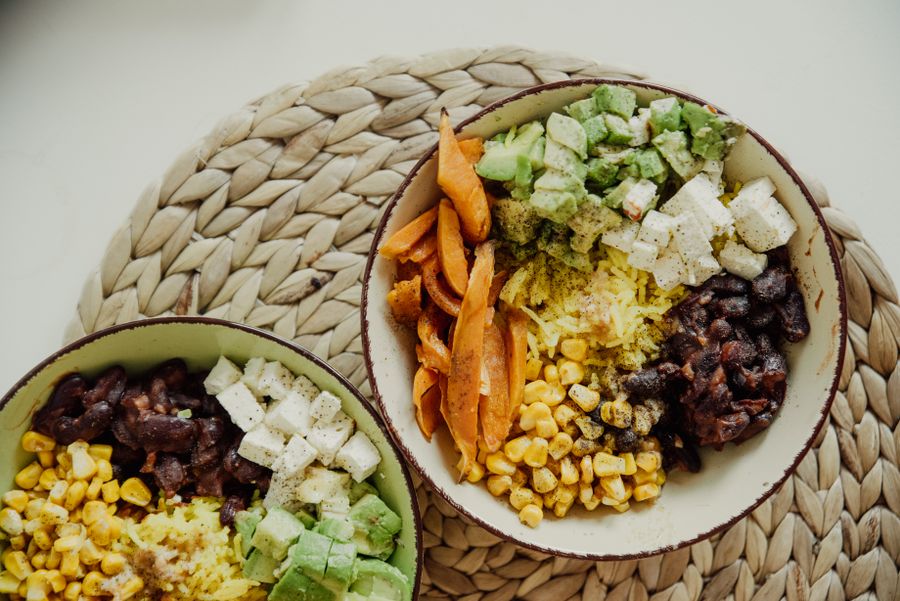 Overhead bowls of corn, avocado and beans — photo by Alesia Kozik on Pexels