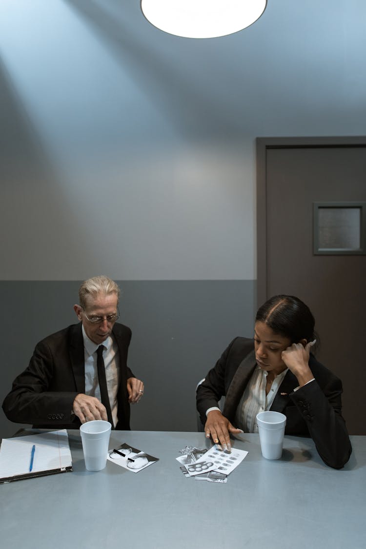 Two Investigators Studying A Case