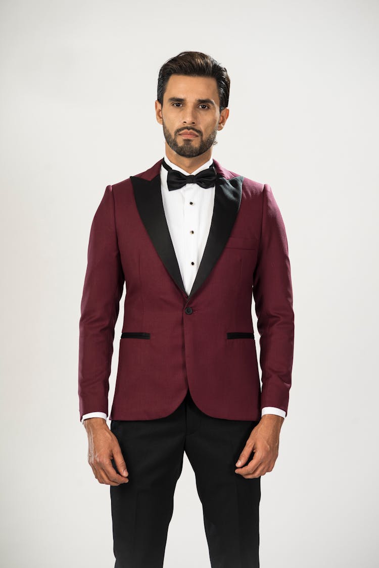 A Man In Red Tuxedo And Black Pants