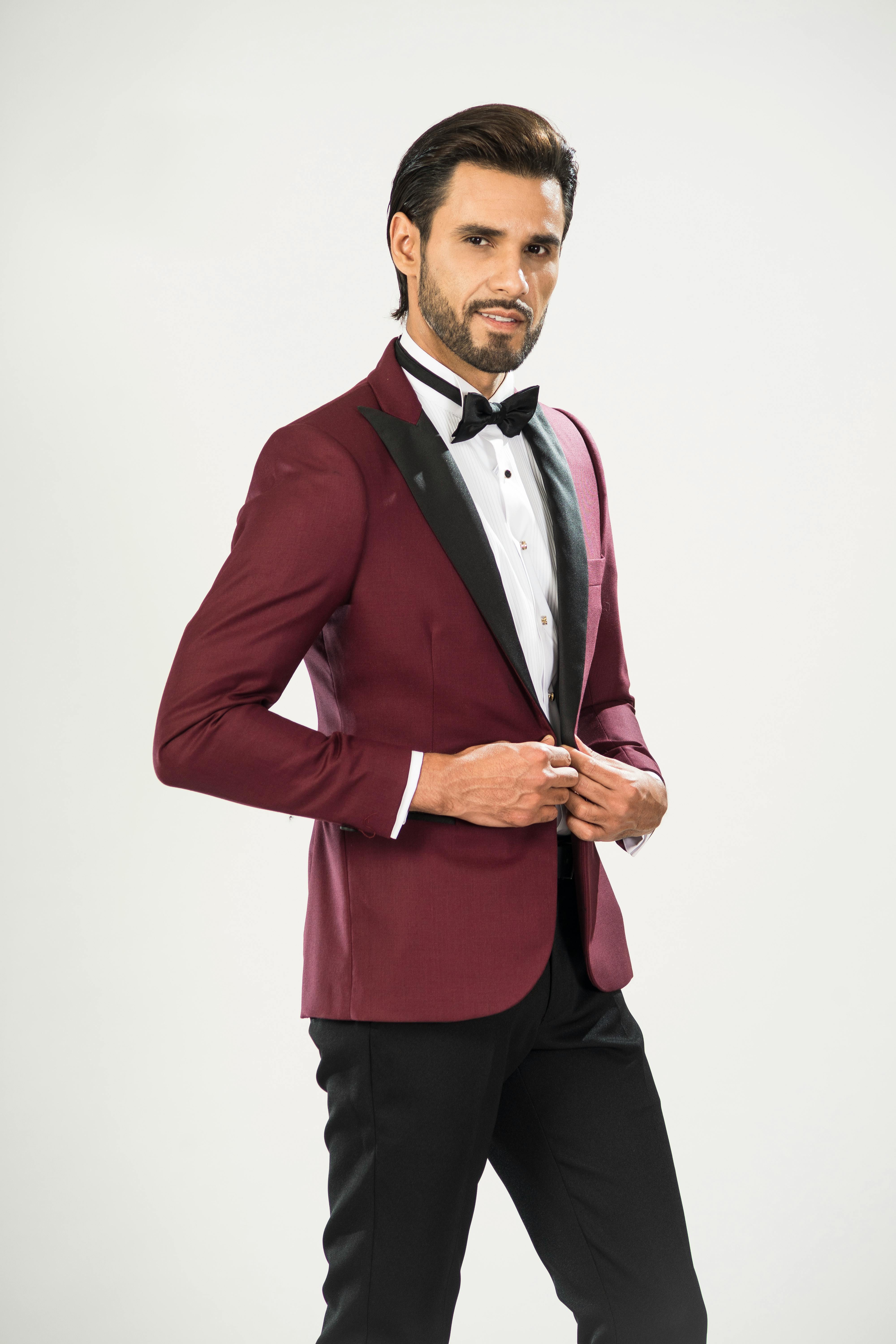 Premium Photo  Fashion young man in black suit and red pants casual pose