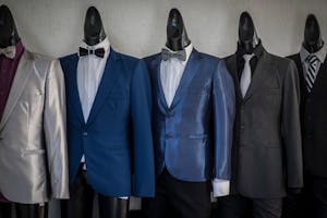 Mannequins with Elegant Suits and Tuxedos