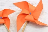 Two Orange Paper Windmills