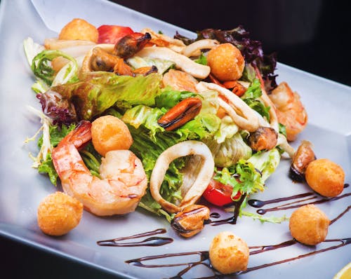 Free Salad Served with Seafood Stock Photo