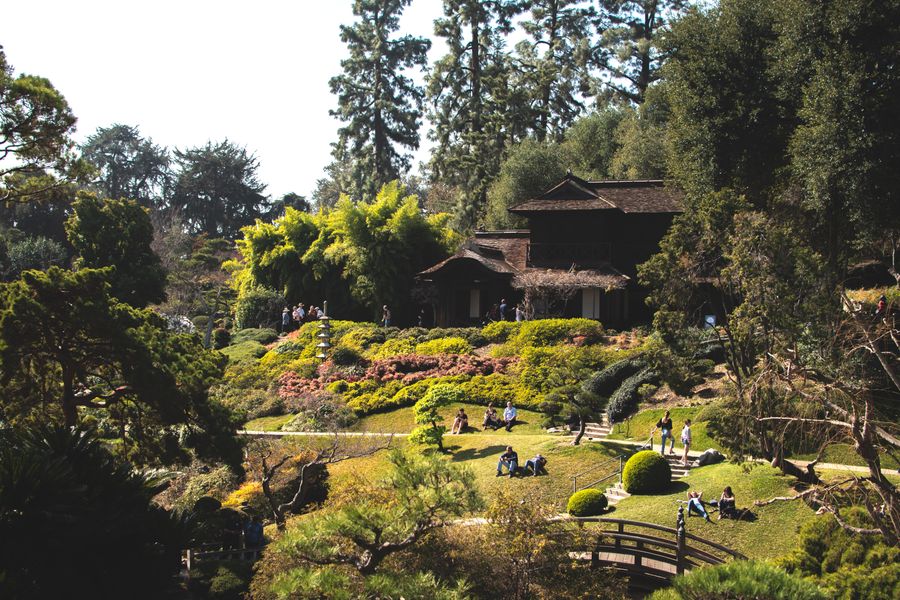 Lush gardens and traditional architecture at the Huntington Library in San Marino with visitors enjoying the grounds