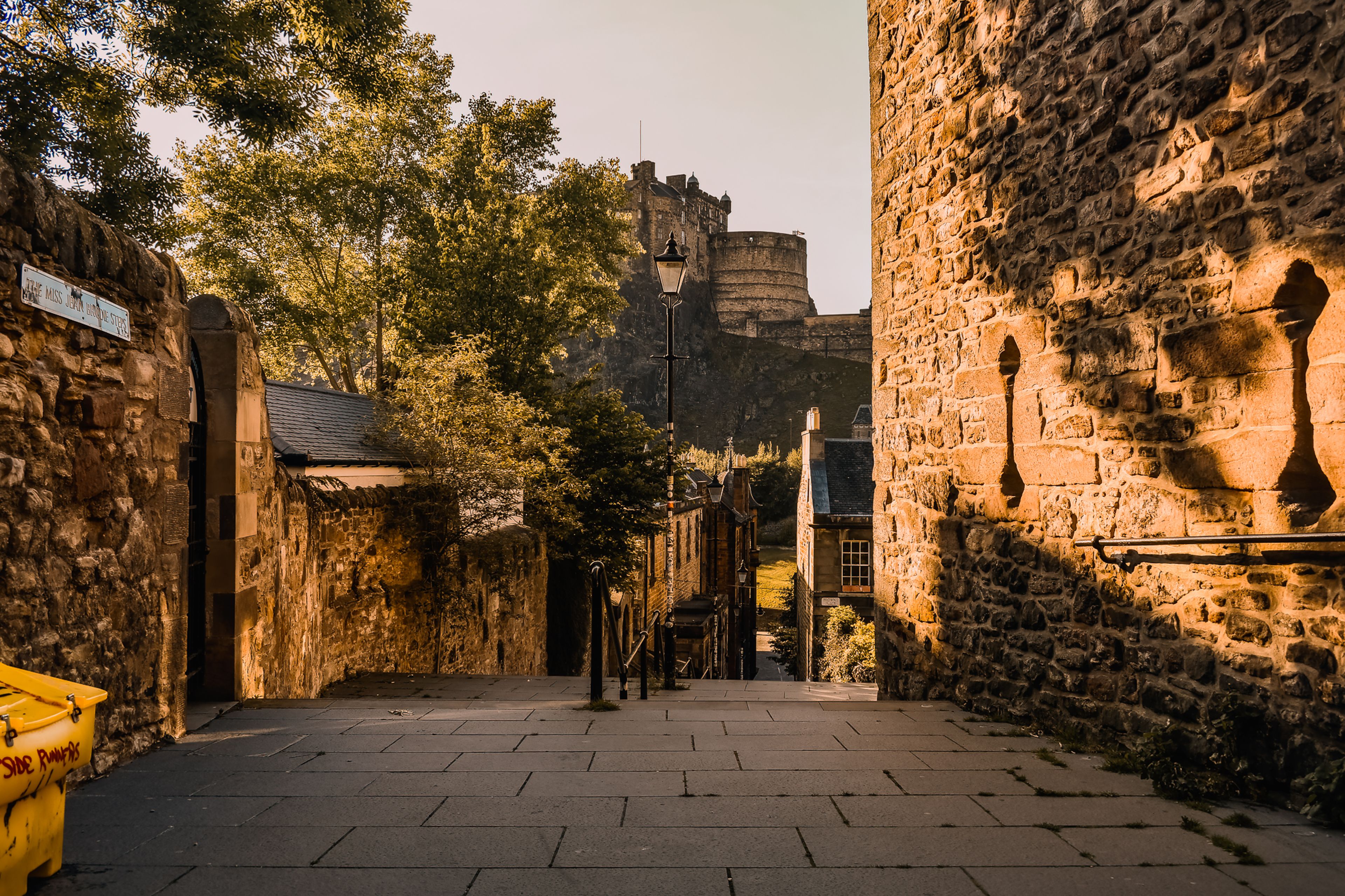 View of Edinburgh Castle from The Vennel showcasing historic Scottish architecture.