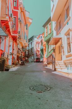 Charming alley with colorful architecture in Istanbul on a sunny day, showcasing vibrant urban lifestyle.