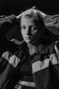 Black and White Photo of a Woman Wearing Jacket