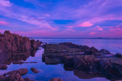 Rock Formations Under a Purple Sunset