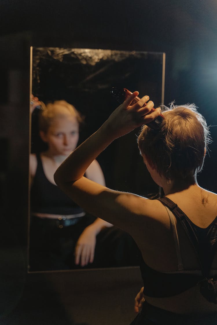 A Woman Shaving Hear Head