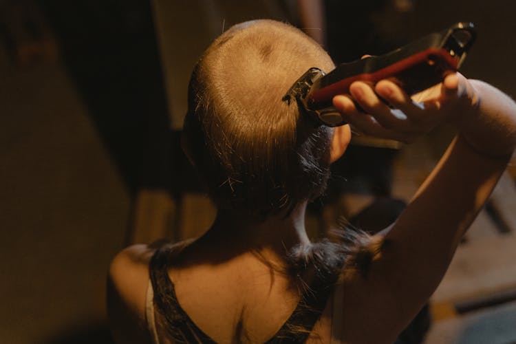 A Woman Shaving Her Head