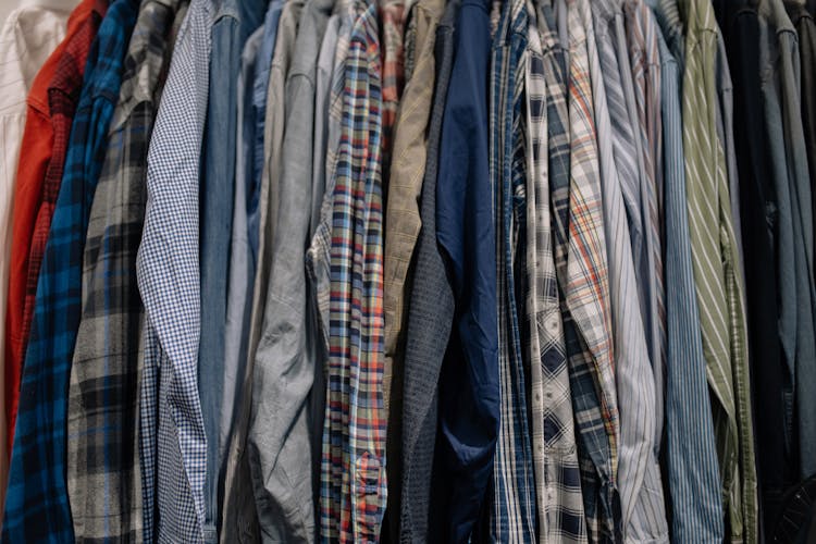 Assorted Clothes Hanged On A Clothes Rack