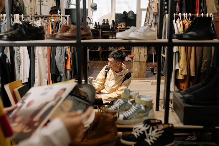 Man Inside A Shop Holding A Pet