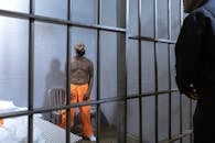 A Shirtless Prisoner Full of Body Tattoos