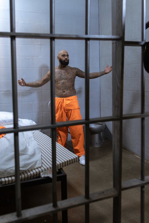Free A Man in Solitary Confinement Inside a Prison Cell Stock Photo