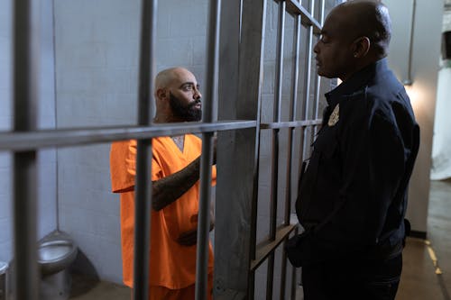 Free A Prisoner Talking to A Police Stock Photo