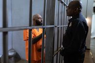 A Prisoner Talking to A Police