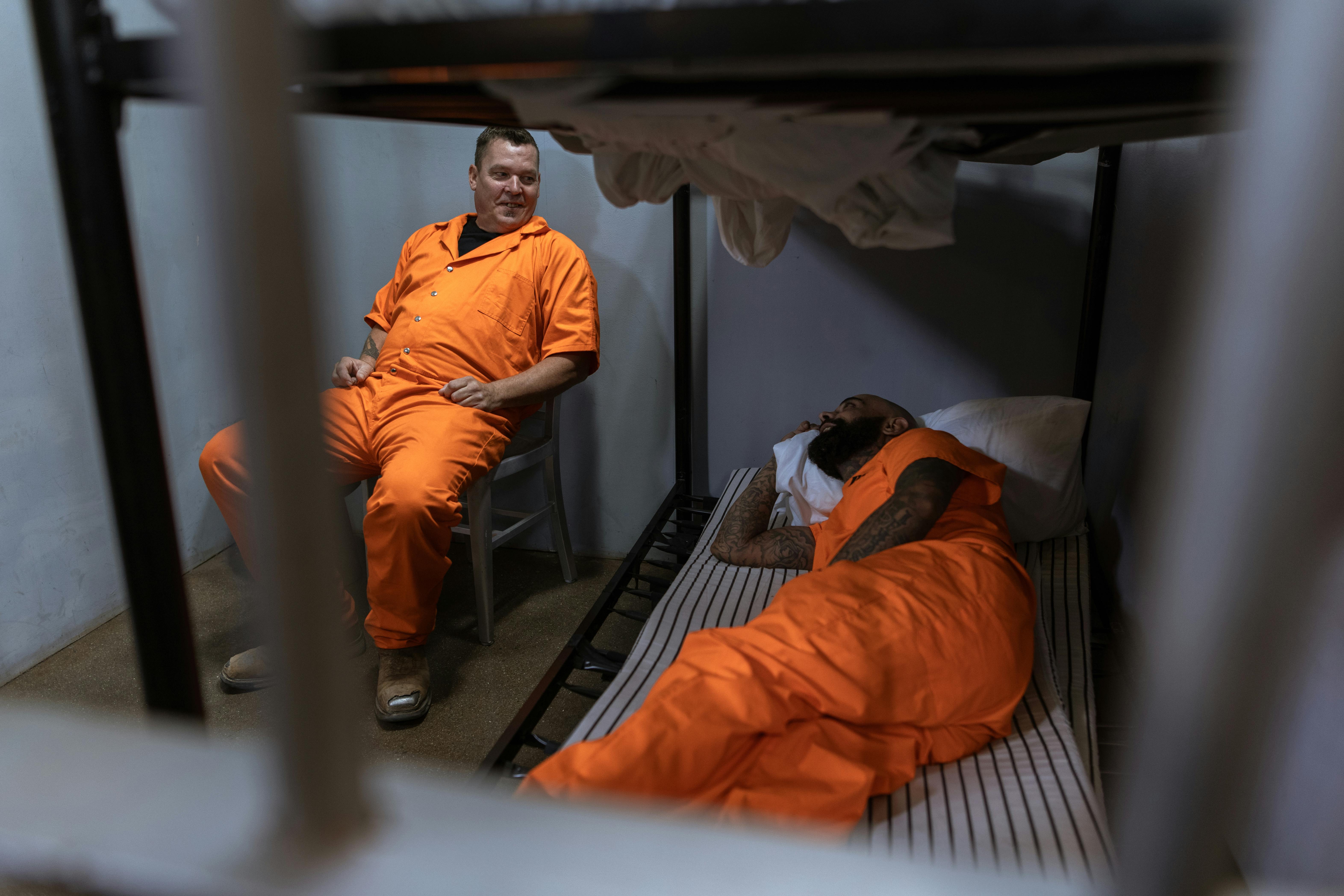 A Bunk Bed With Striped Foam Mattress in a Prison Cell · Free Stock Photo