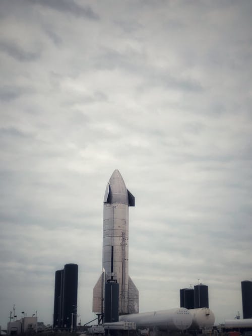 A Rocket Under Cloudy Sky