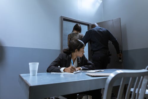 People Inside Investigation Room