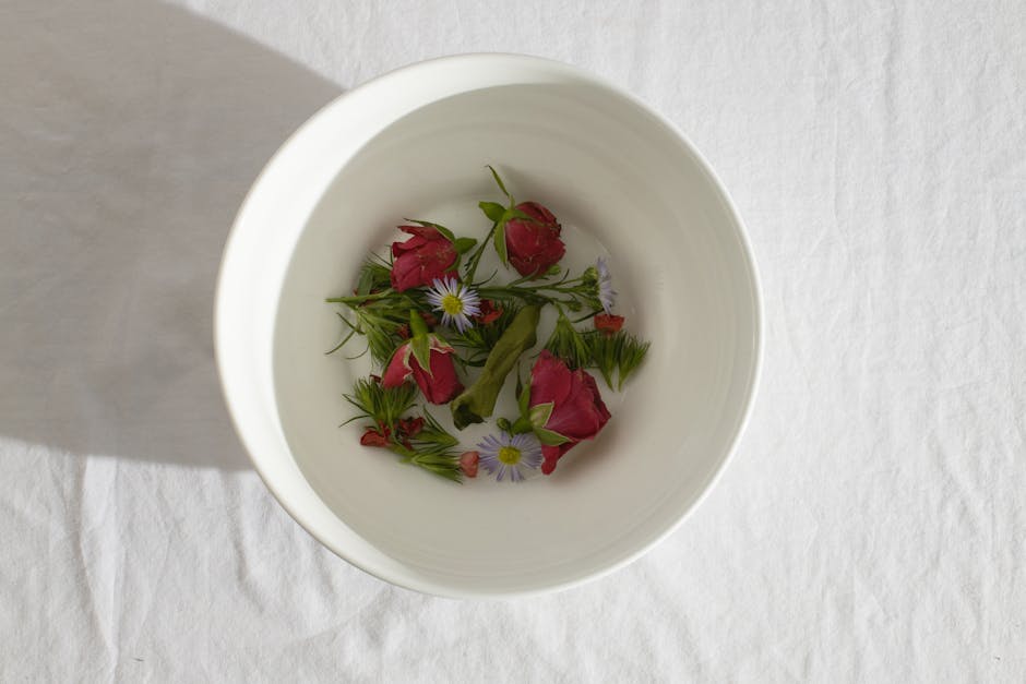 White bowl with fresh delicate flowers