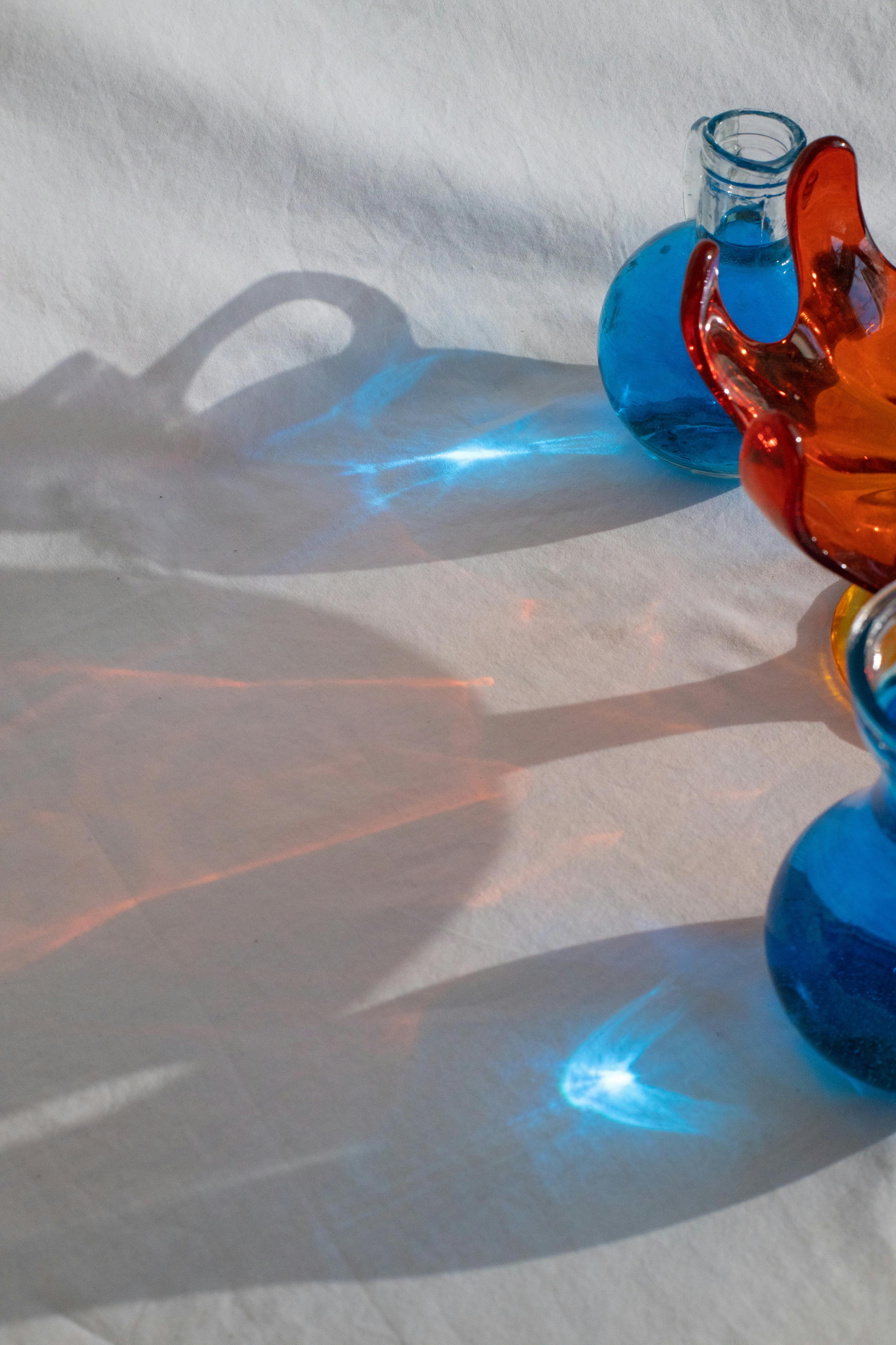 glassware with blue transparent liquid in bright daylight