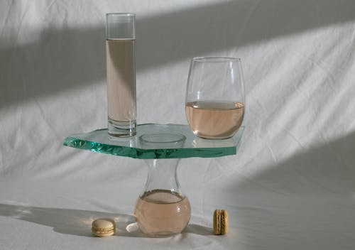 Composed glassware with wine and macaroons