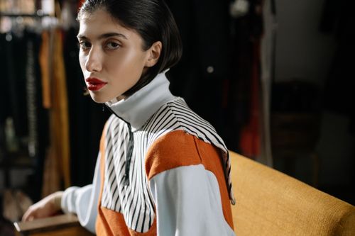 Free Elegant portrait of a fashionable woman in a turtleneck and red lips, showcasing style. Stock Photo