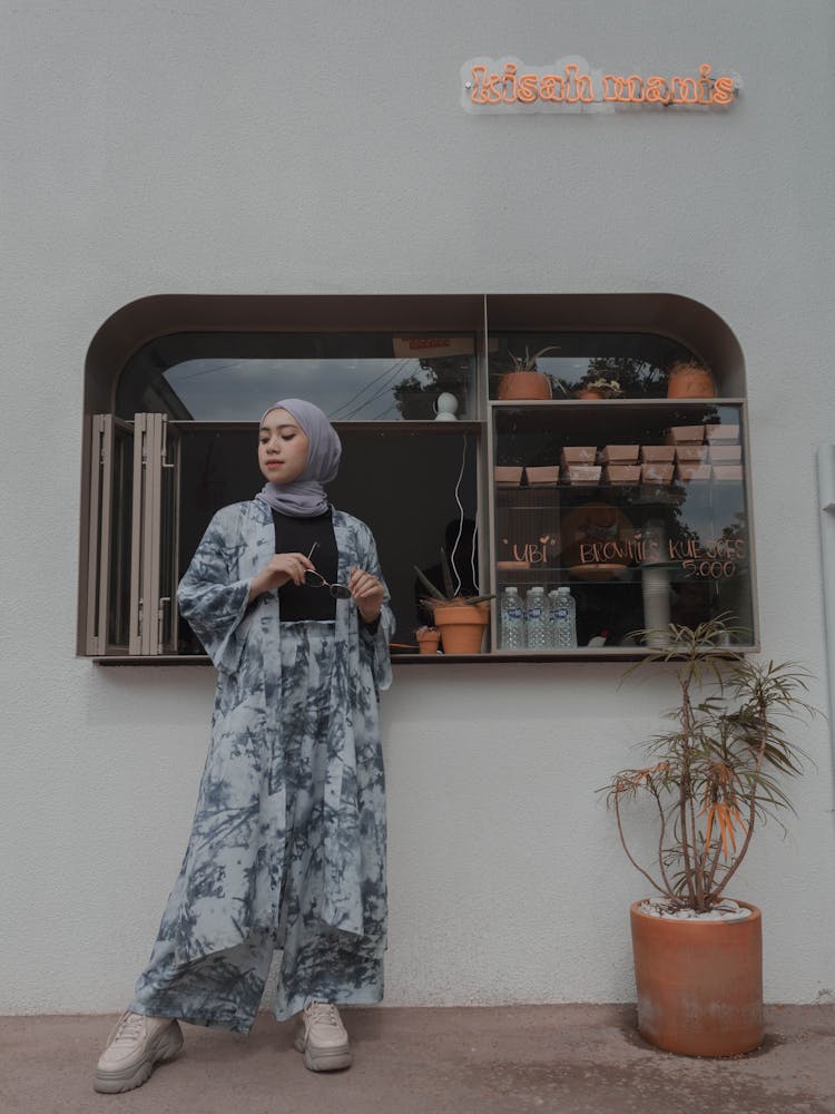 Attractive Muslim Woman Standing Near Street Cafe Counter