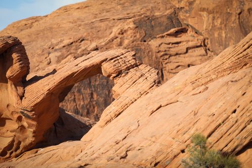 Free Stunning sandstone arch surrounded by rugged rock formations in Valley of Fire, Nevada. Stock Photo