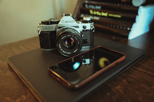 Camera and a Smartphone on a Laptop