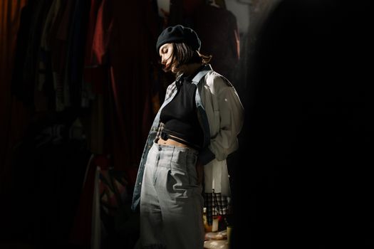 Retro-inspired portrait of a fashionable woman in a casual vintage outfit and beret.