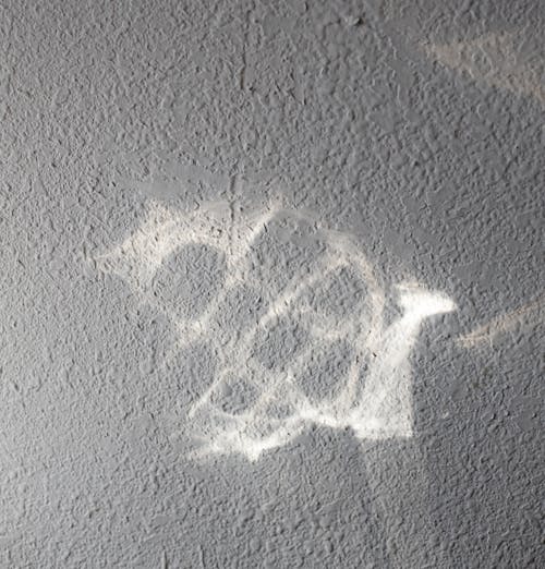 White chalk drawing on gray uneven surface