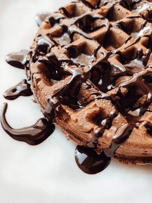 Close-Up Shot of a Waffle with Chocolate Syrup 