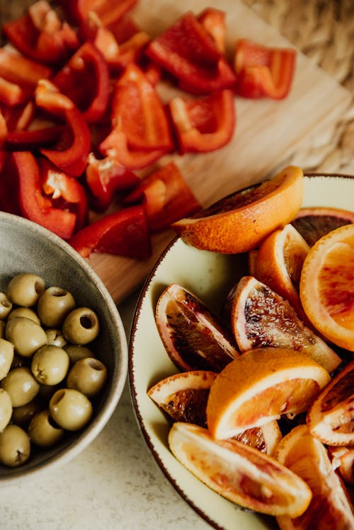 Close-Up Shot of Sliced Fruits in a Bowl