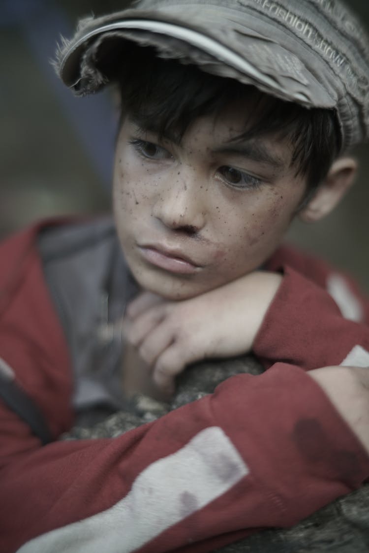 Crop Poor Melancholic Ethnic Boy On Street