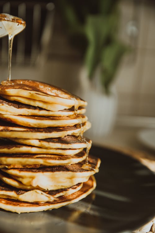 Free Syrup Pouring on Top of Stack Pancakes  Stock Photo