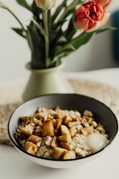 Nourishing bowl of oatmeal topped with cinnamon apples, perfect for a healthy start to the day.